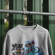 sweatshirt-mockup-hanging-on-metal-rod-against-green-wooden-wall-outdoor-light-0286 (1)