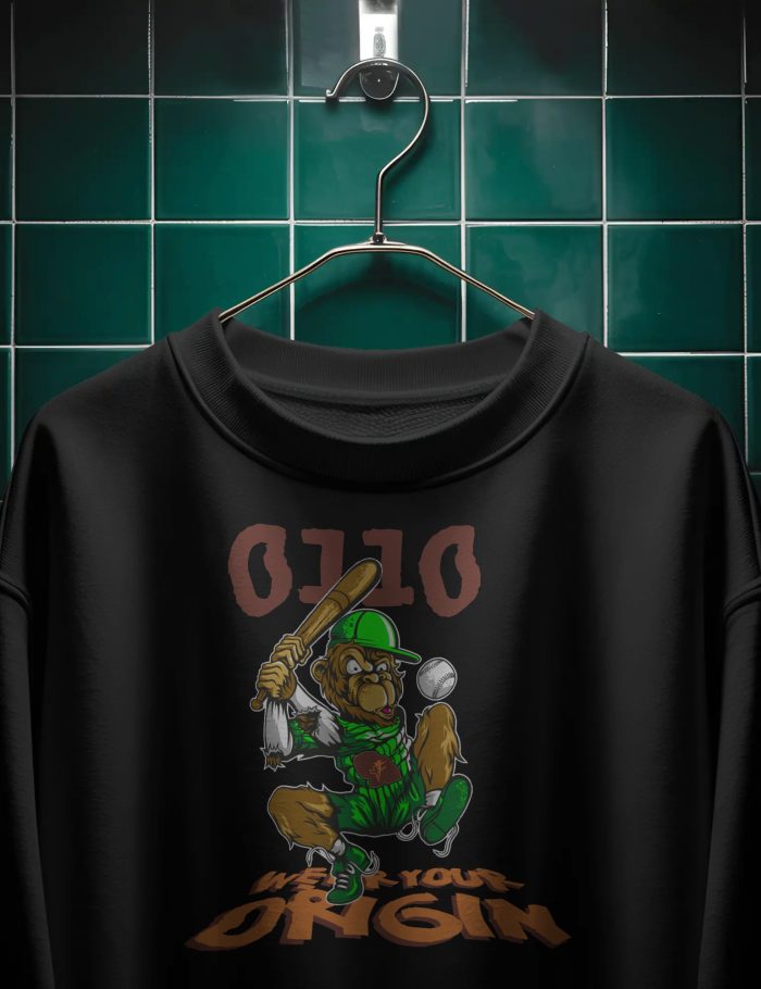 hanging-sweatshirt-mockup-in-dark-moody-bathroom-setting-with-tiled-green-wall-backdrop-0289